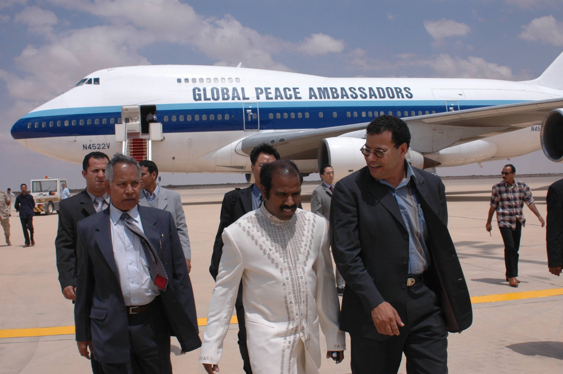Dr. K.A. Paul with Global Peace Ambassadors delegation on tarmac