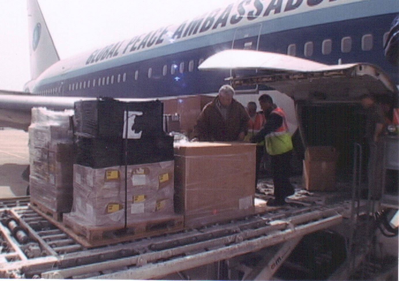 Humanitarian cargo being unloaded from an Air Madagascar aircraft for relief work